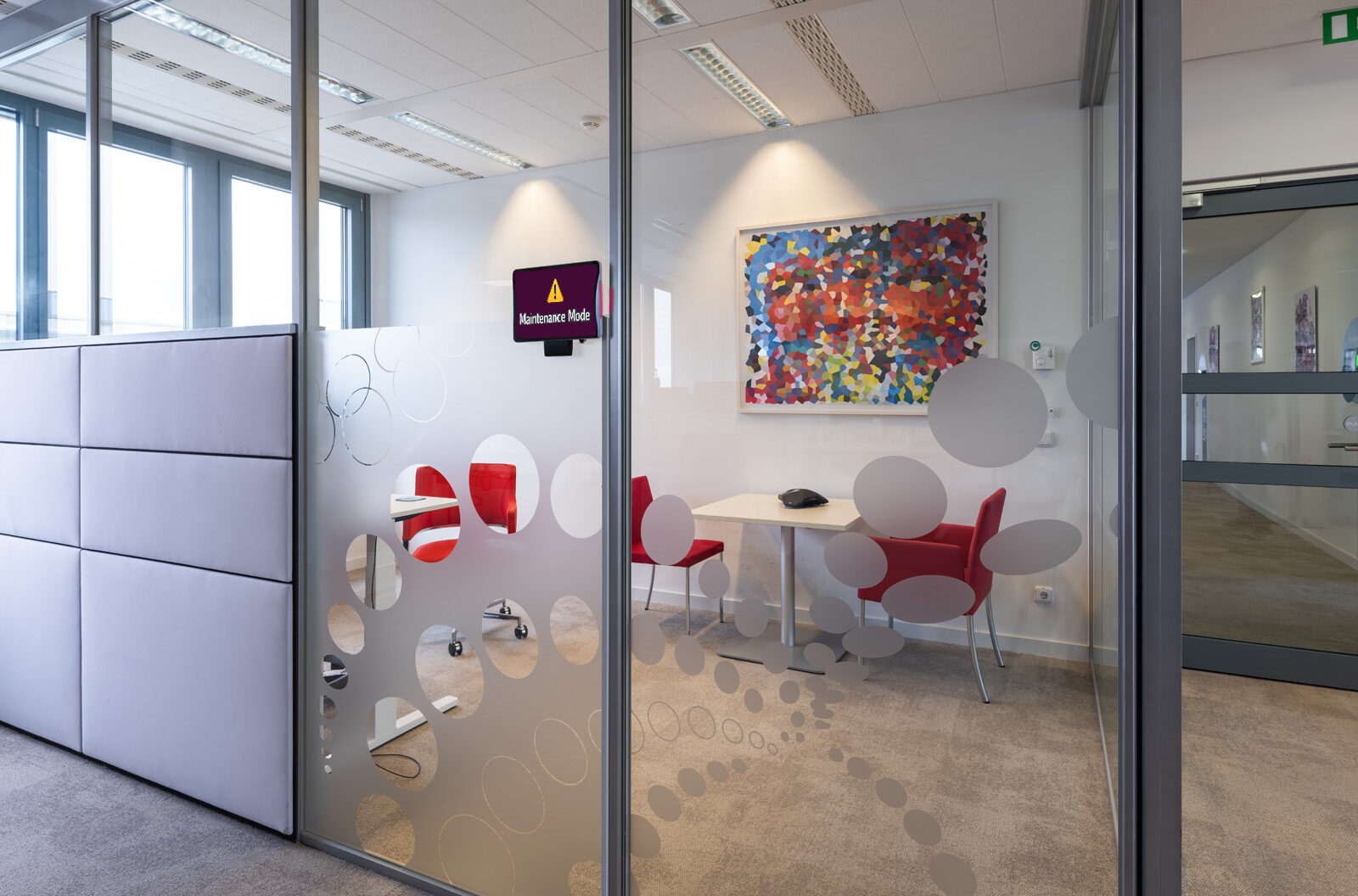 GoBright platform showing Maintenance Mode activated on a meeting room, with the room marked as unavailable in the room booking overview